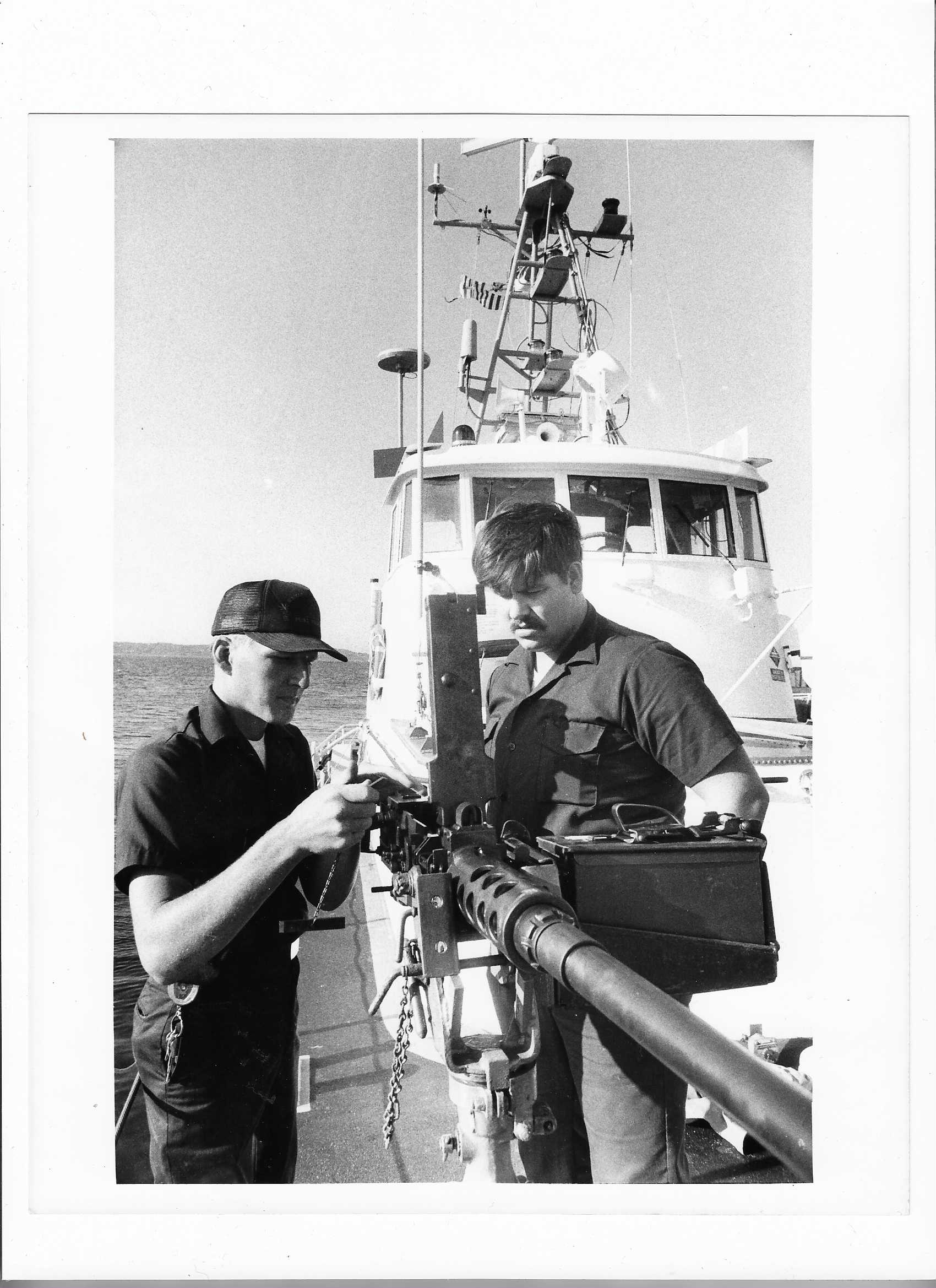 Point Francis crew members maintain the .50 caliber machine gun located on the bow. (Courtesy of Eric Heestand) Point Francis crew members maintain the .50 caliber machine gun located on the bow. (Courtesy of Eric Heestand)